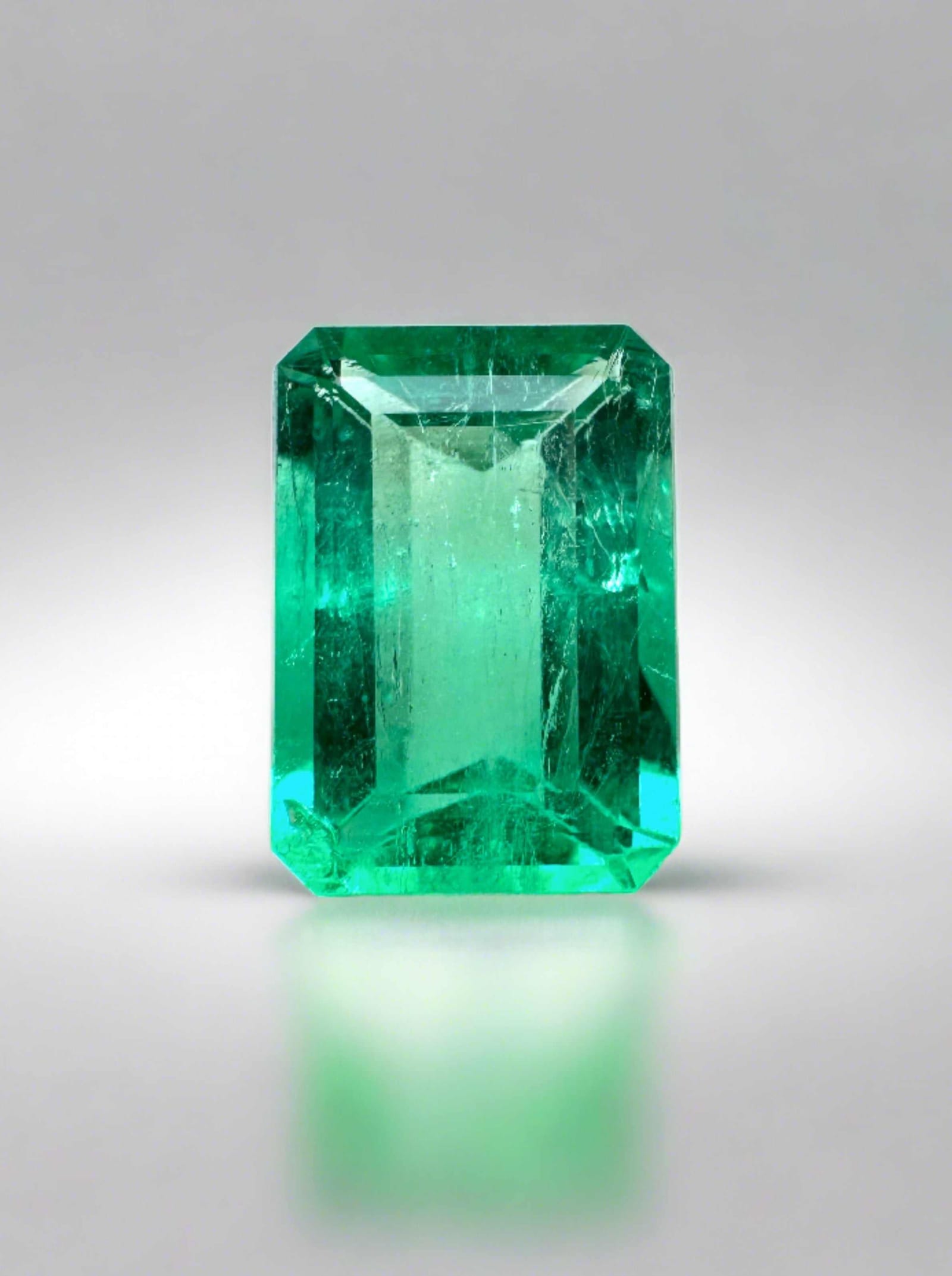 1.50 carat chromatic green natural Colombian emerald with visible jardin