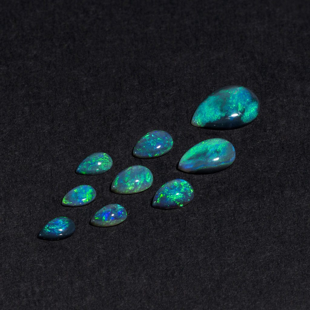 Lightning Ridge black opal pears with vivid green play-of-color